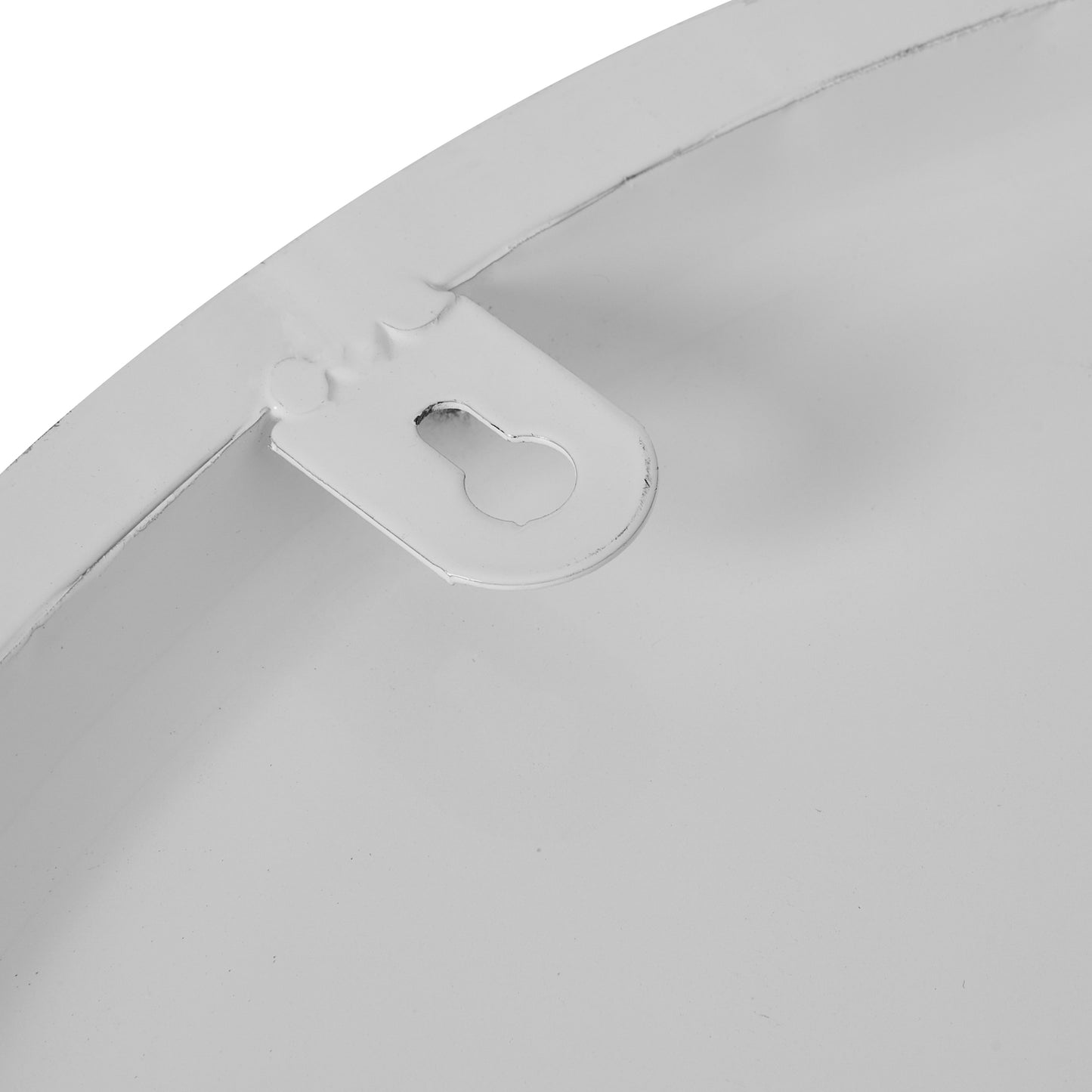 Close-up of a white plastic clip on a white background