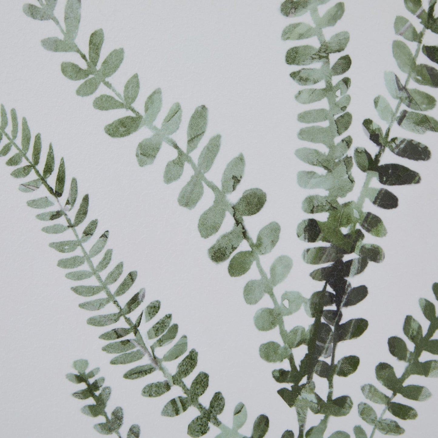 Green leafy pattern on a light gray background