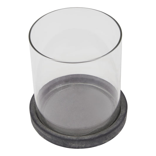 Clear glass container with a black rubber base on a white background