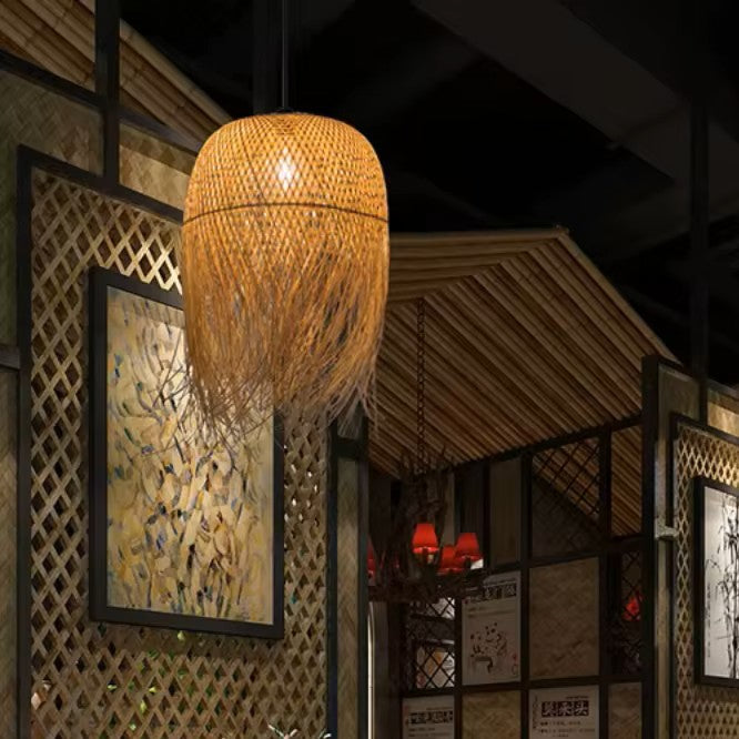 Woven pendant light hanging in a dimly lit room with decorative elements.