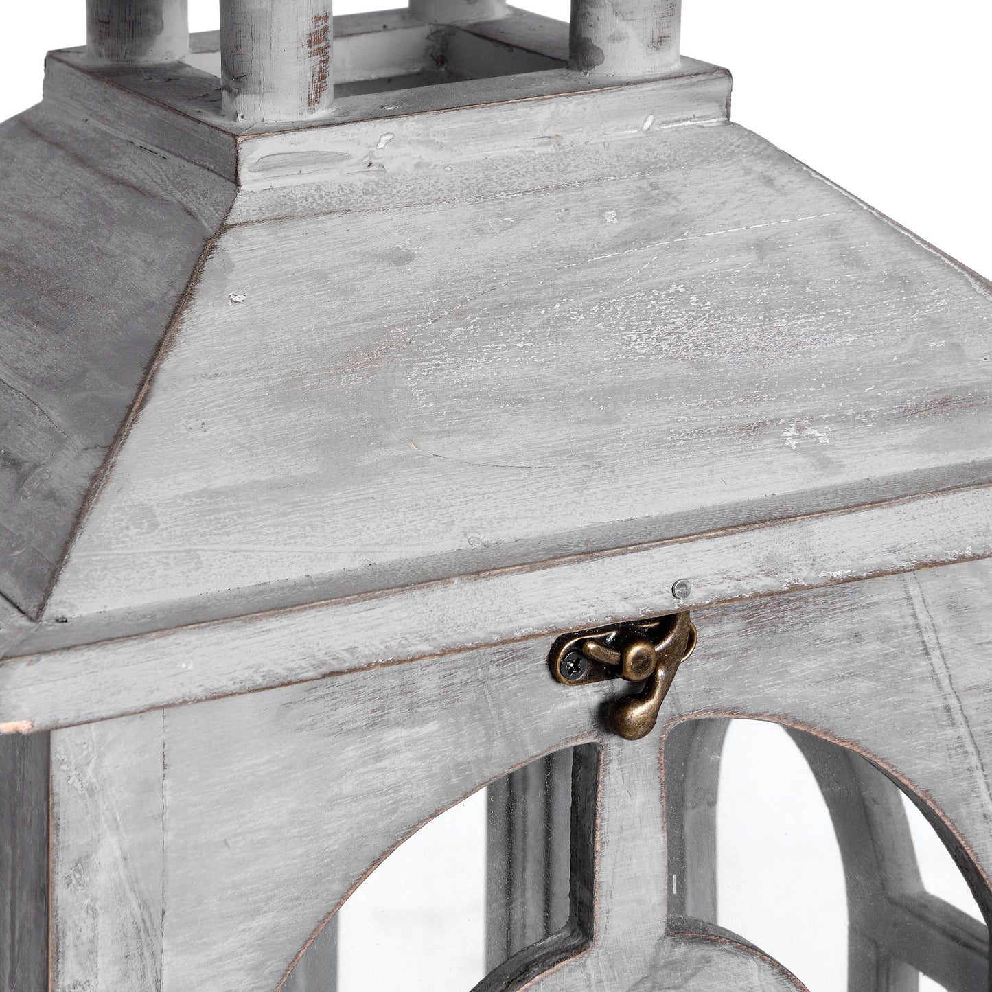 Close-up of a wooden lantern with a metal latch on a white background