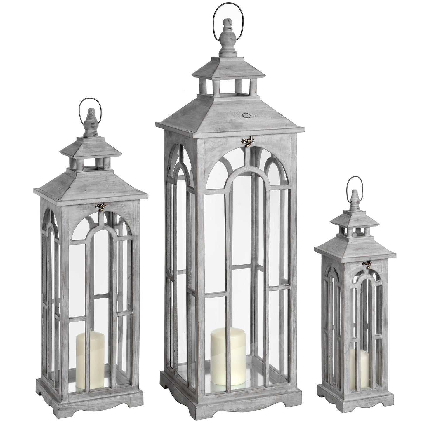 Set of three gray lanterns with candles inside on a white background