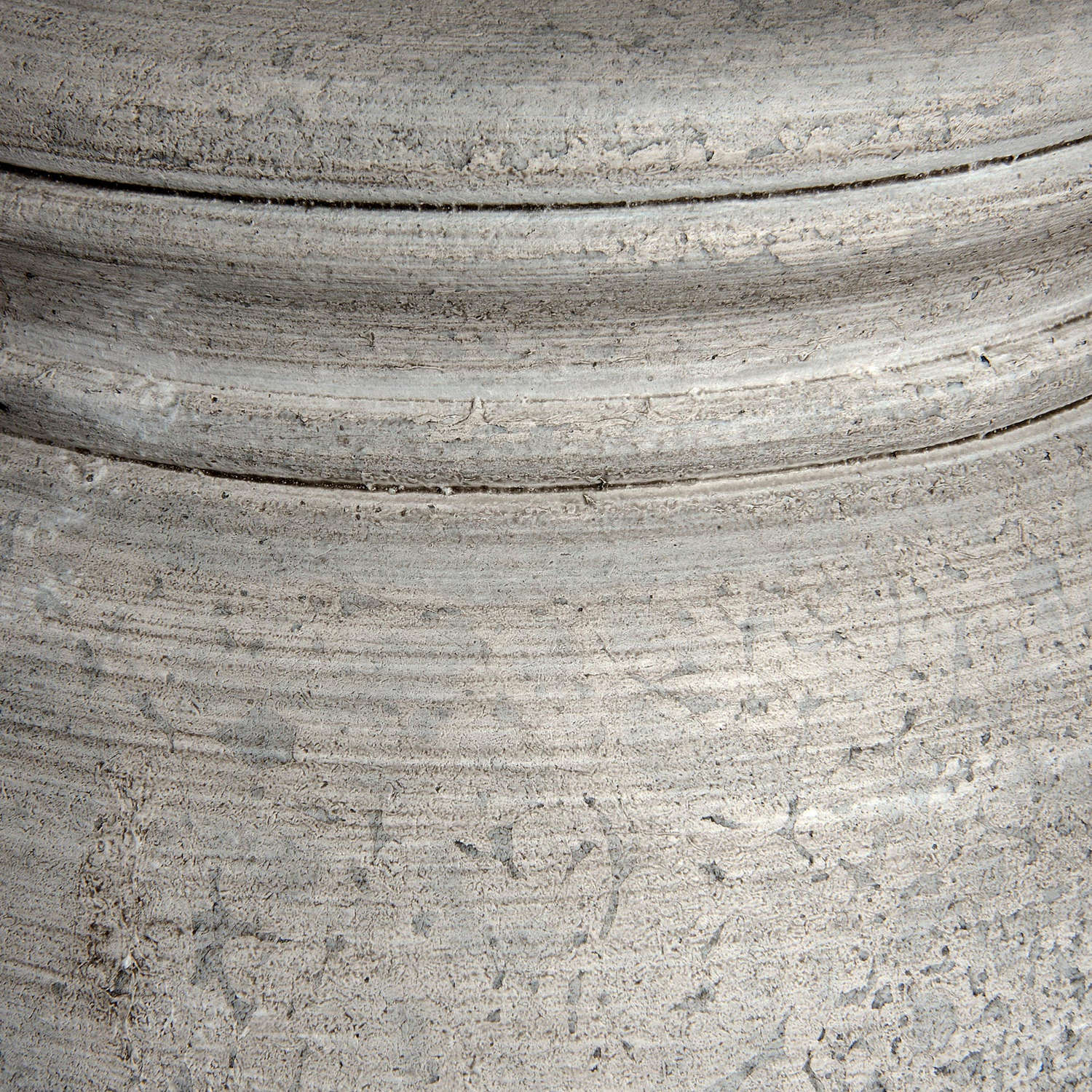 Close-up of a textured gray surface with concentric circular patterns