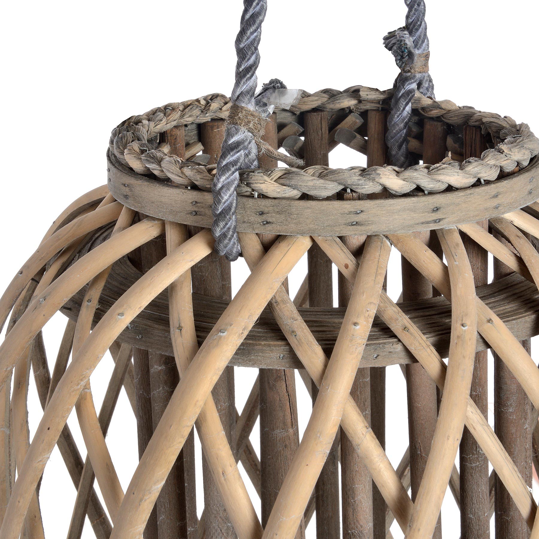 Close-up of a woven rattan basket with rope handles on a white background