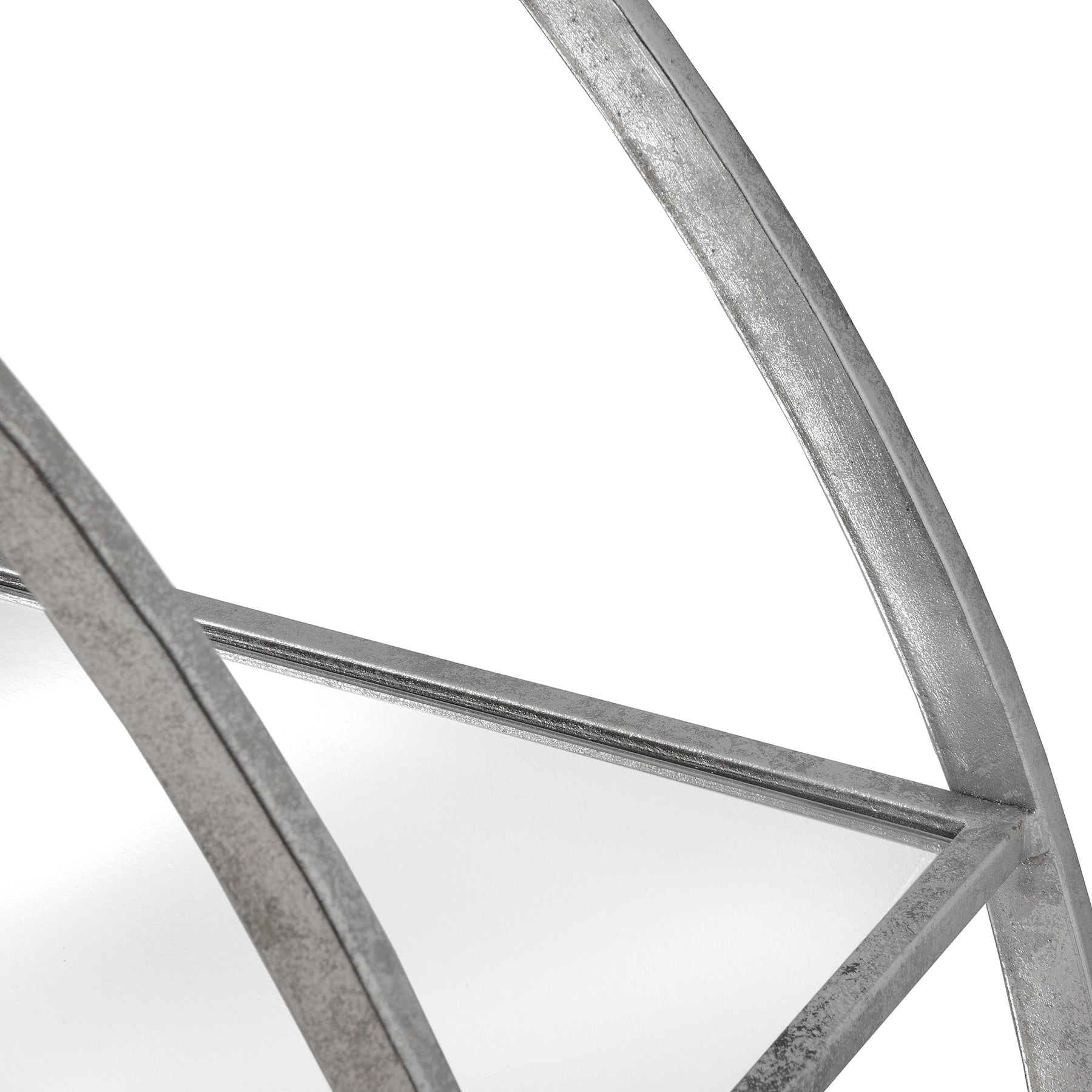 Close-up of a metallic frame with geometric design on a white background