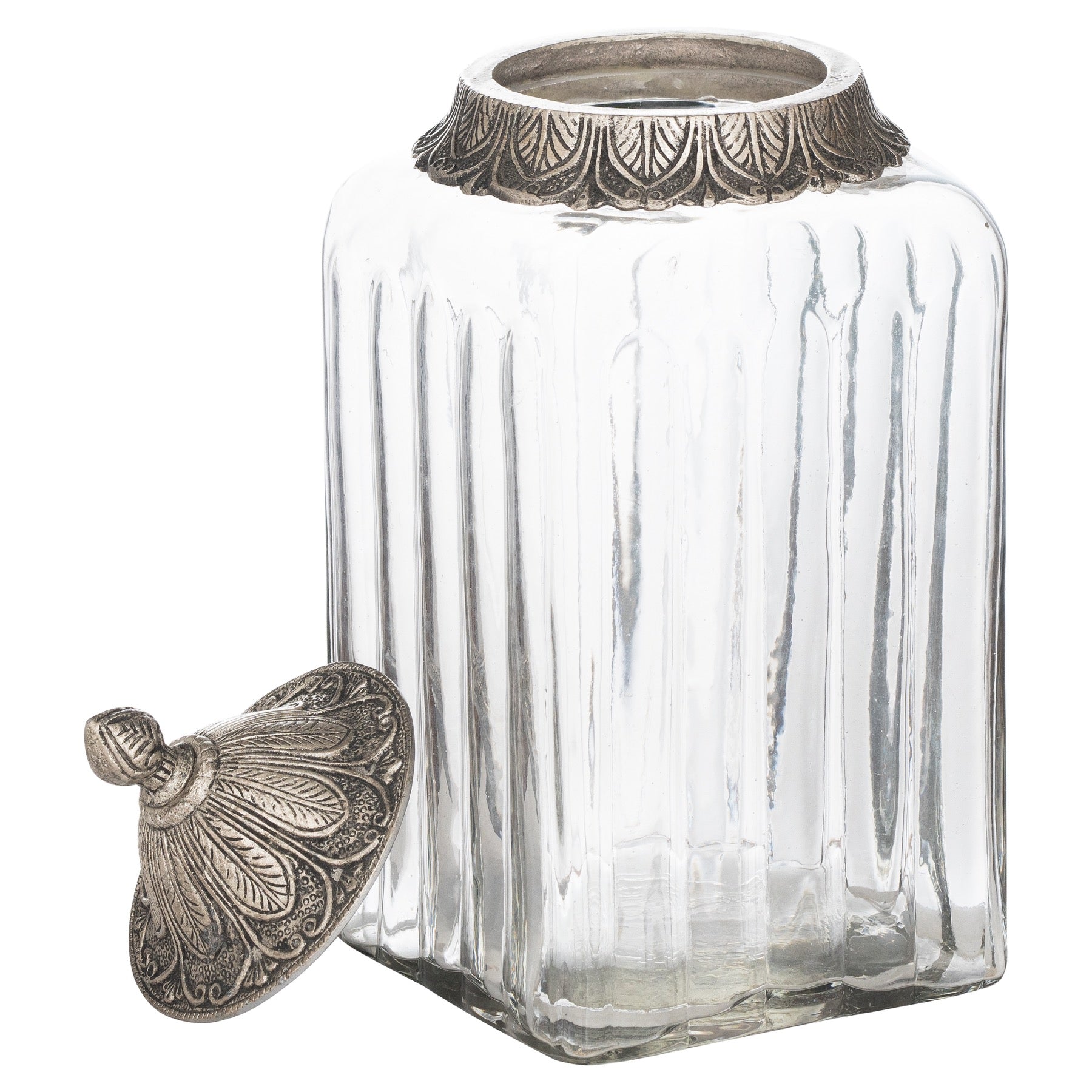 Clear glass jar with ornate silver lid on a white background