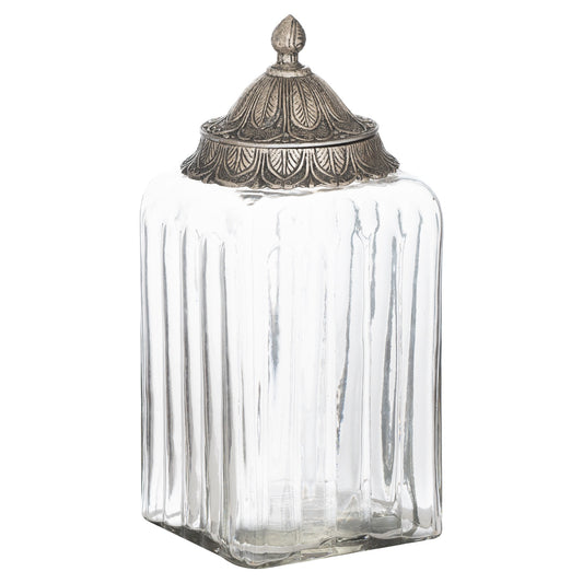 Clear glass jar with an ornate silver lid on a white background