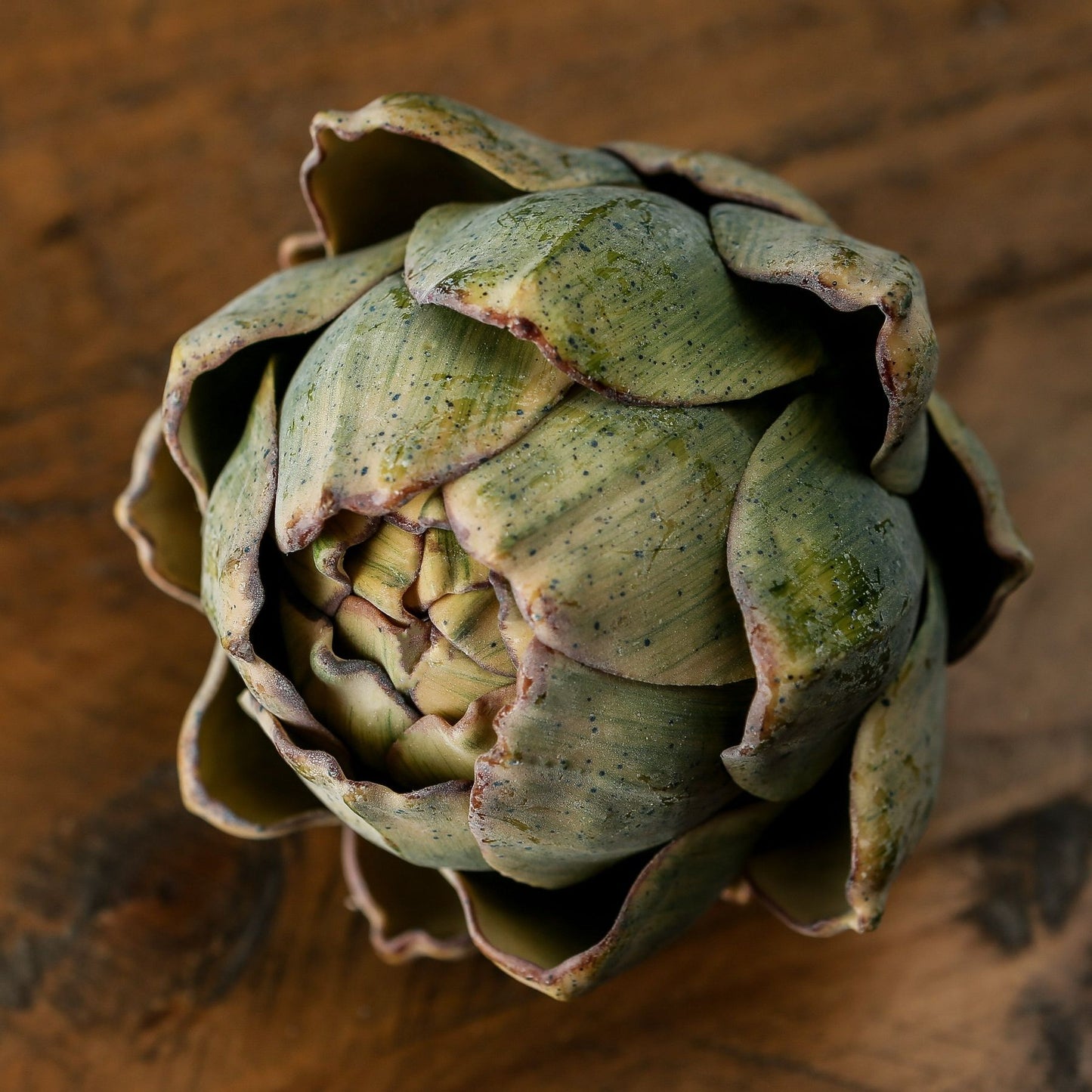 Artichoke on a wooden surface