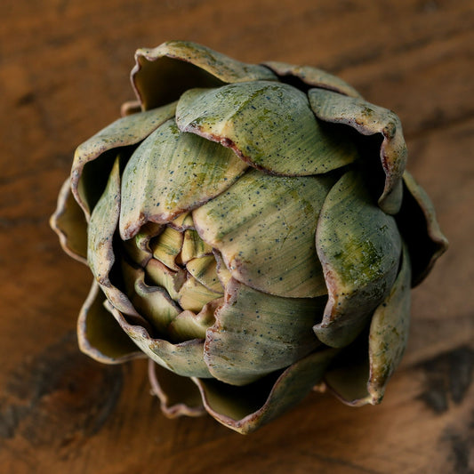 Artichoke on a wooden surface