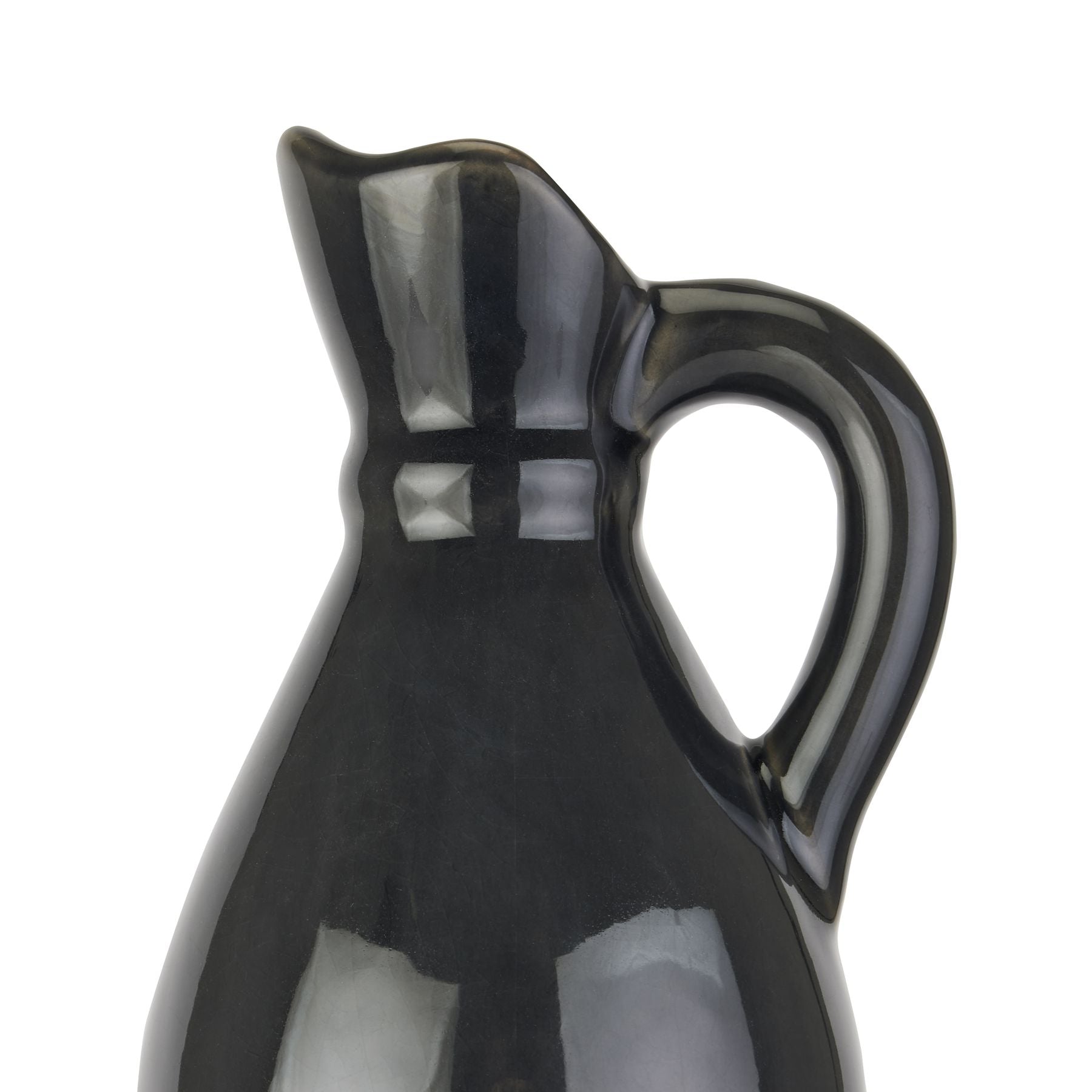 Navy blue ceramic pitcher on a white background