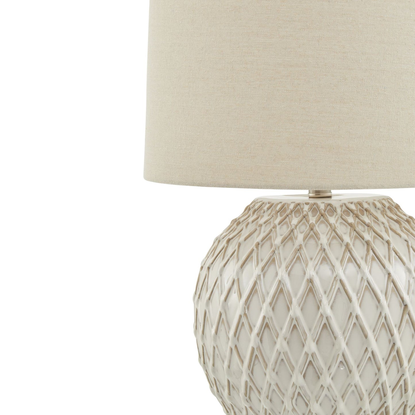 Decorative lamp with textured base and beige shade on a white background