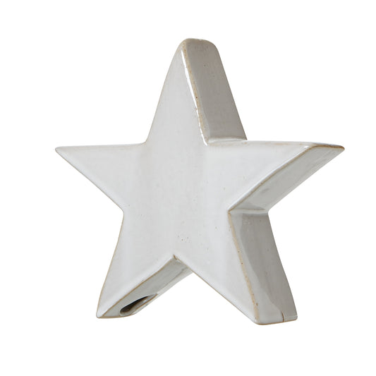 White ceramic star-shaped object on a white background