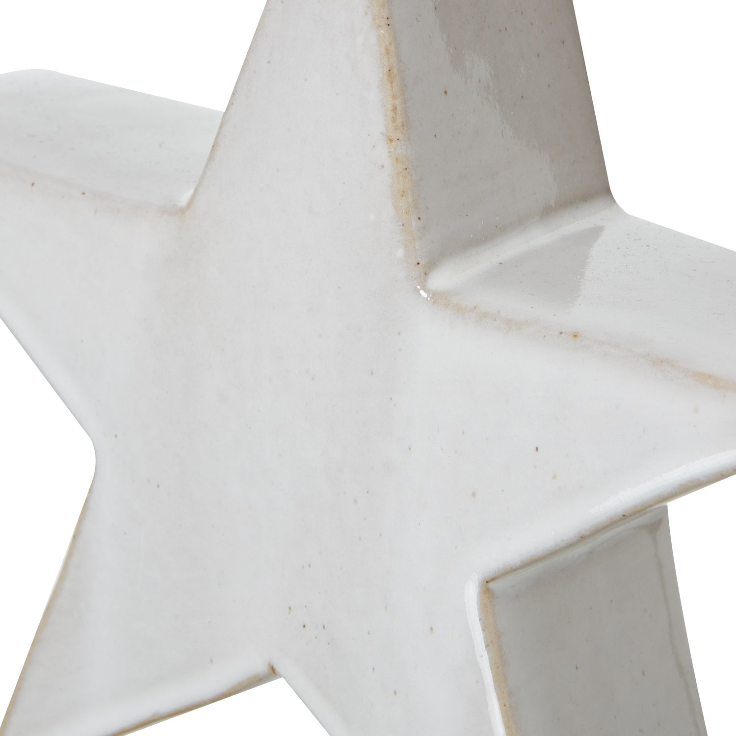Close-up of a white ceramic star-shaped object on a white background