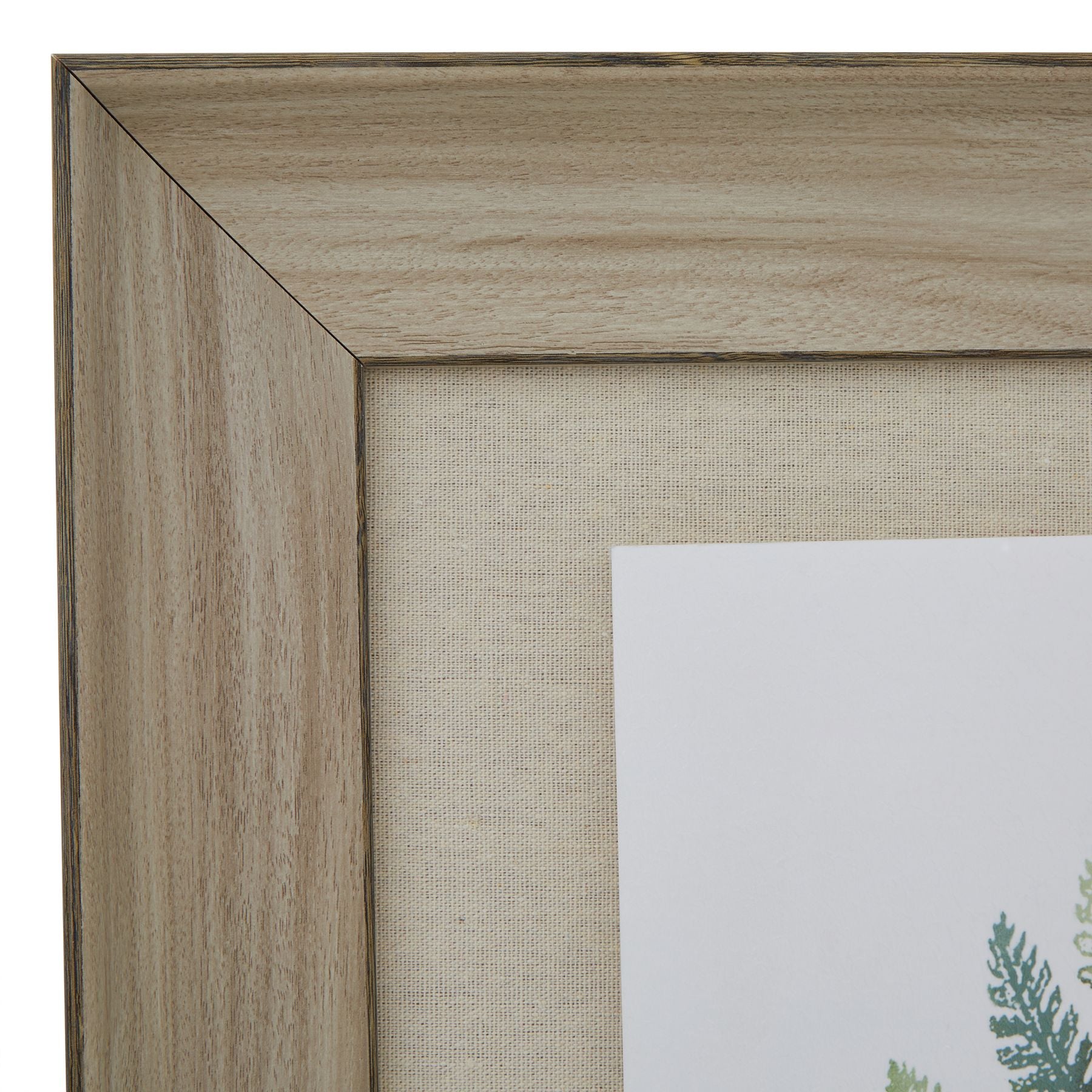 Close-up of a wooden picture frame with a partially visible artwork inside.