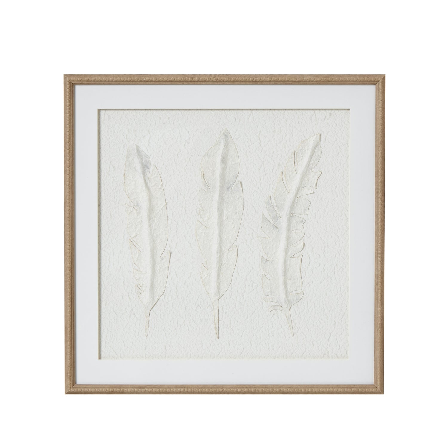 Framed artwork with embossed leaves on a white background