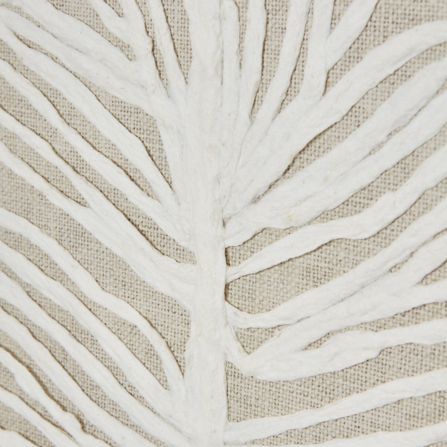 Close-up of white leaf pattern on beige fabric