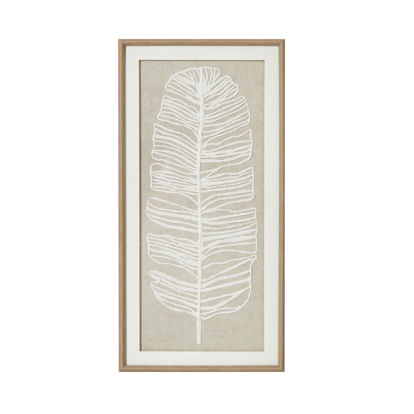 Framed artwork with a white leaf design on a beige background