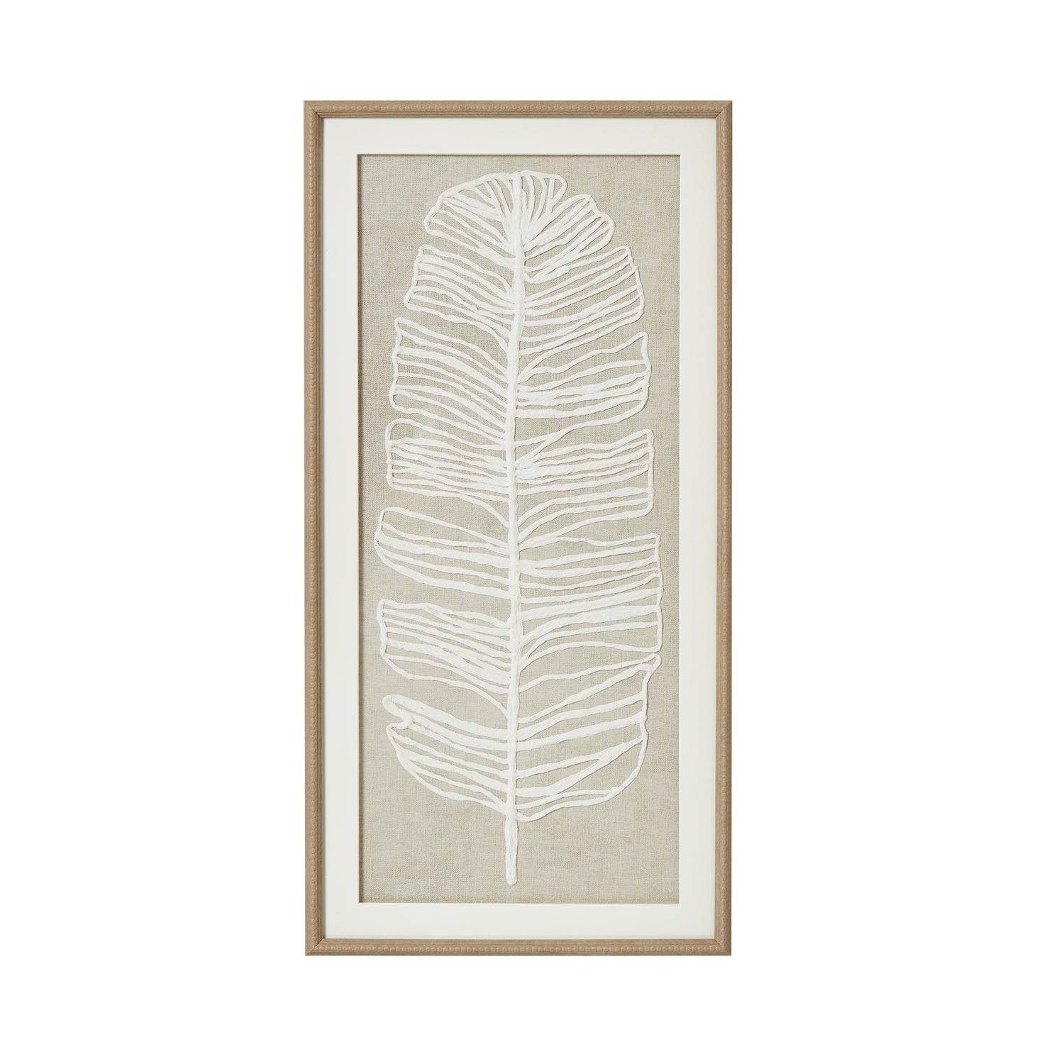 Framed artwork with a white leaf design on a beige background