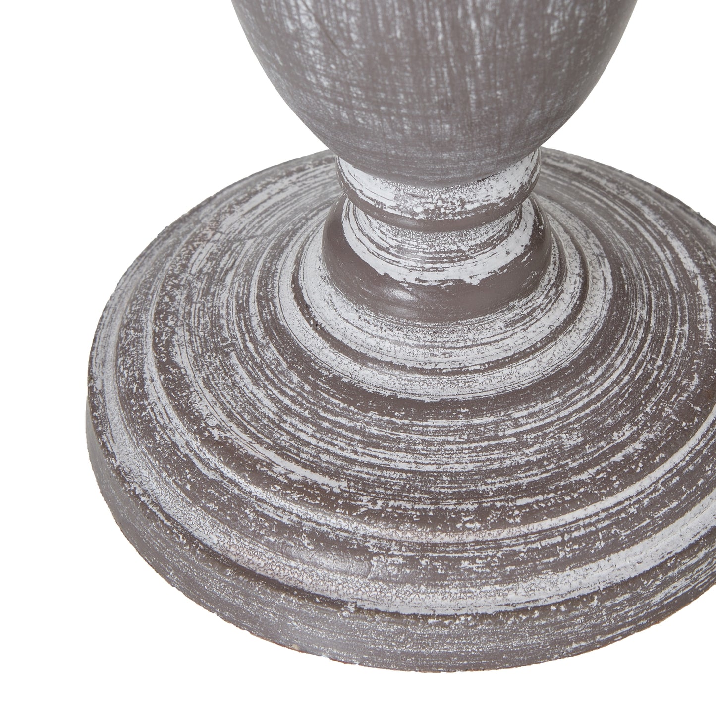 Close-up of a textured gray pedestal on a white background