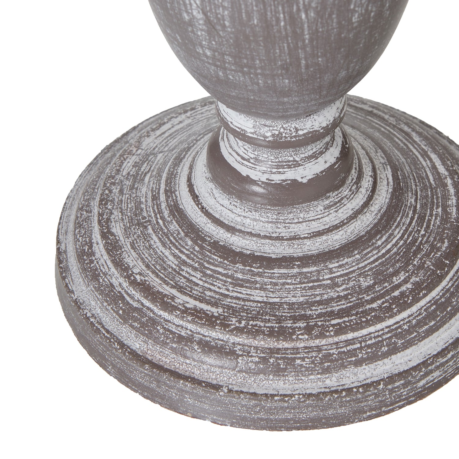 Close-up of a textured gray pedestal on a white background