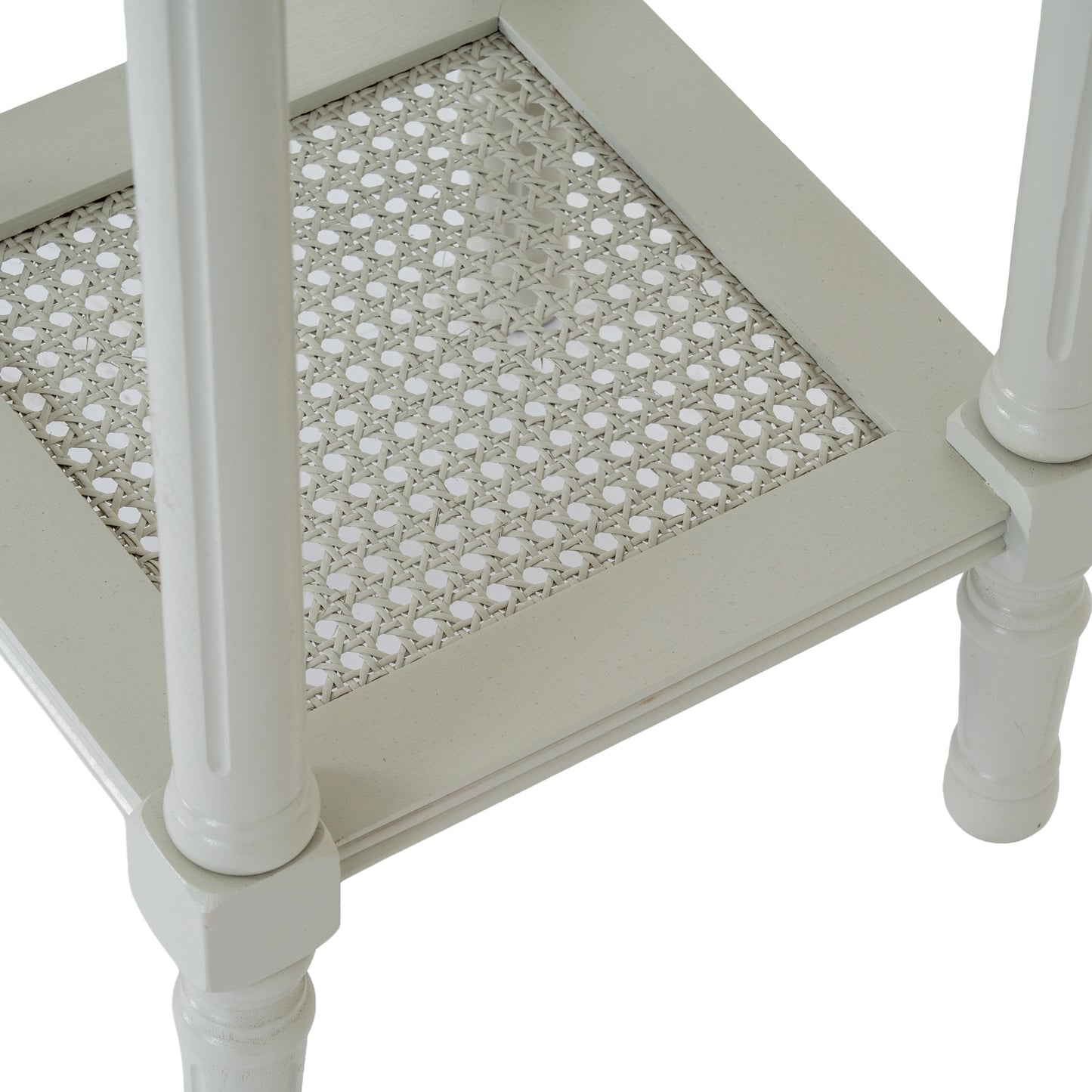 White side table with a patterned top on a white background