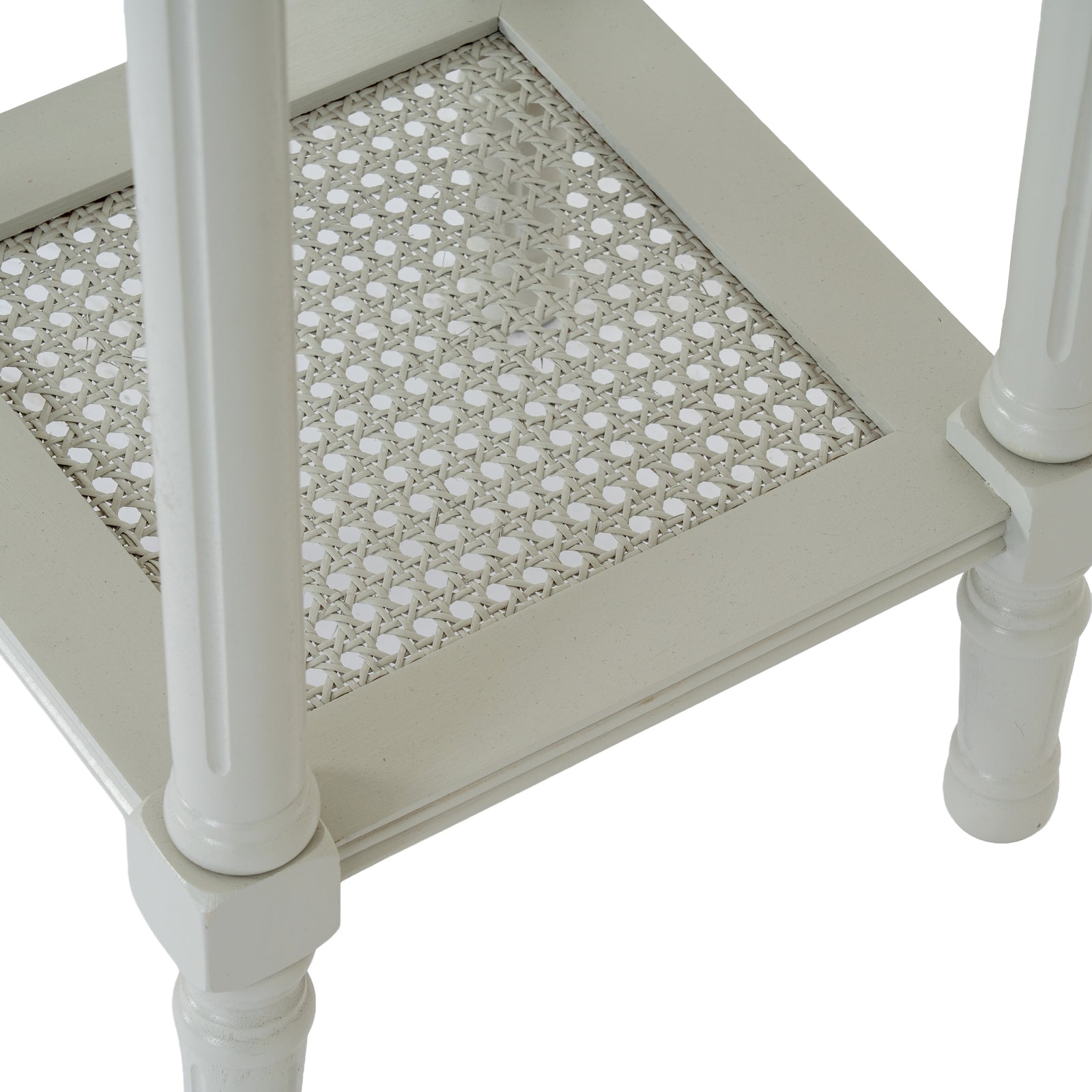 White side table with a patterned top on a white background