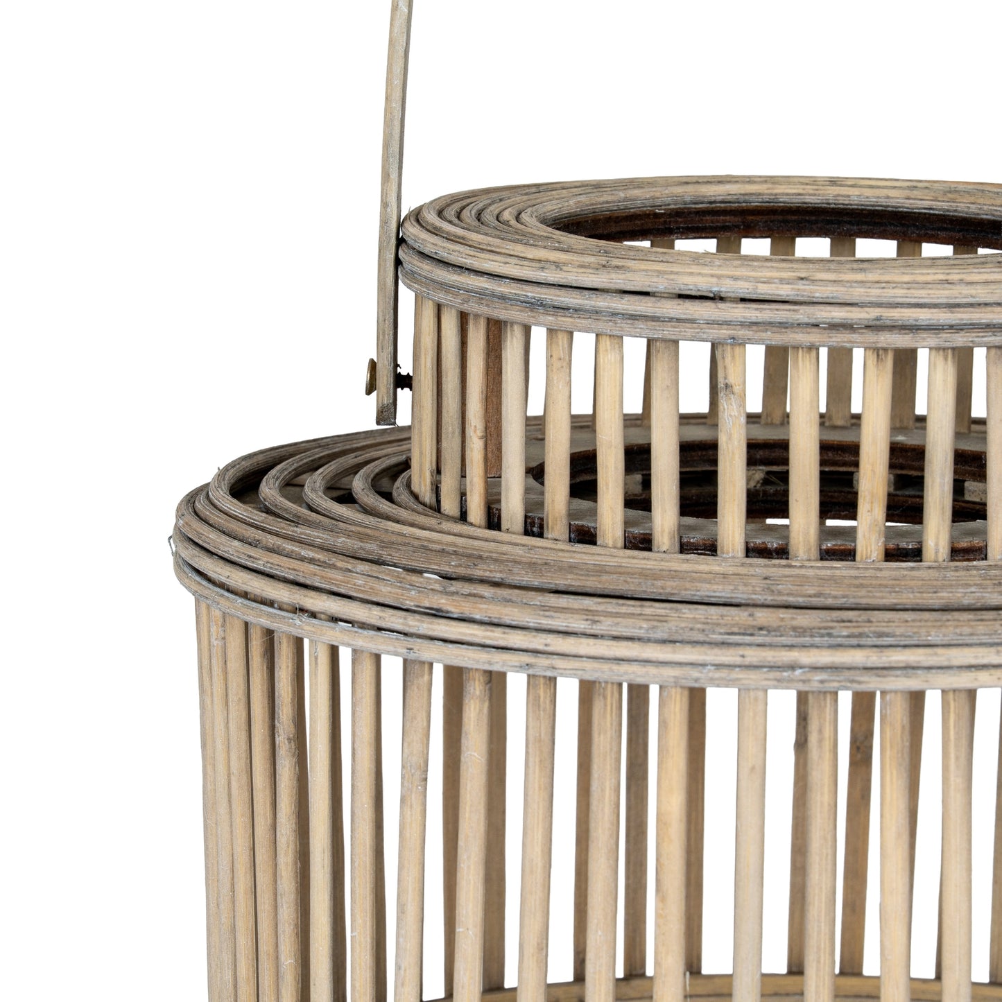 Woven rattan basket with a handle on a white background