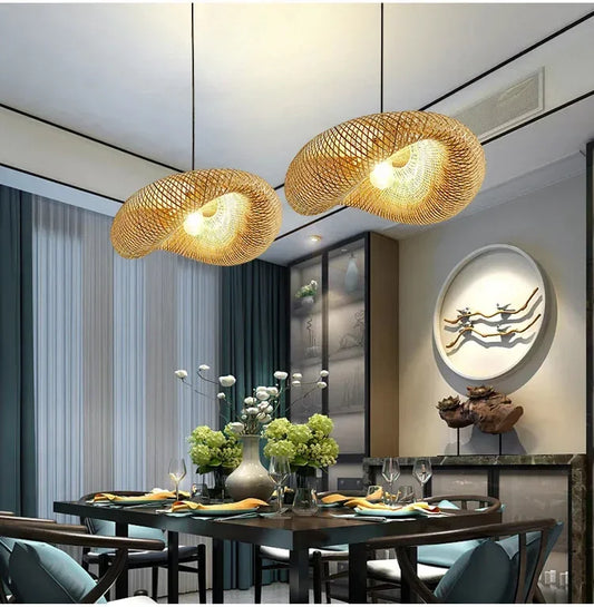 Modern dining room with decorative pendant lights and a table set for dinner.