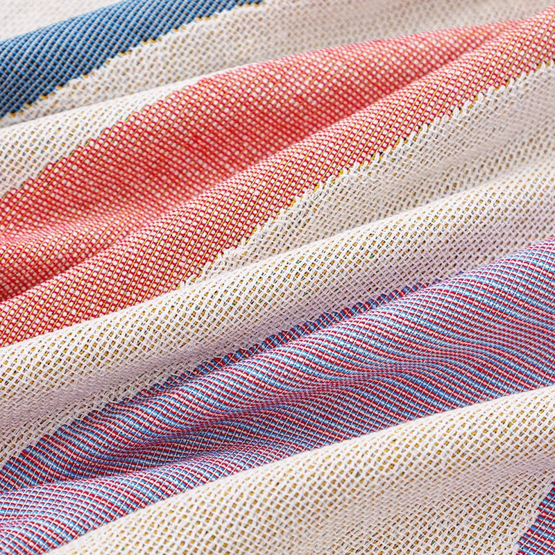Close-up of fabric with red, blue, and beige stripes.