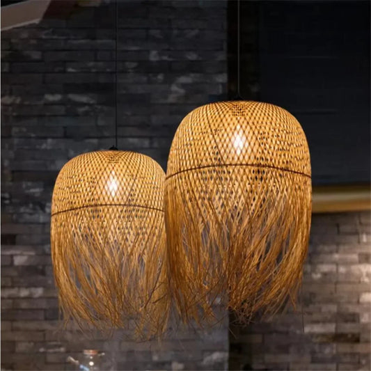 Two woven pendant lights against a stone wall background